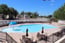 Outdoor Pool With Splash Pad And Hot Tub 1 of 15